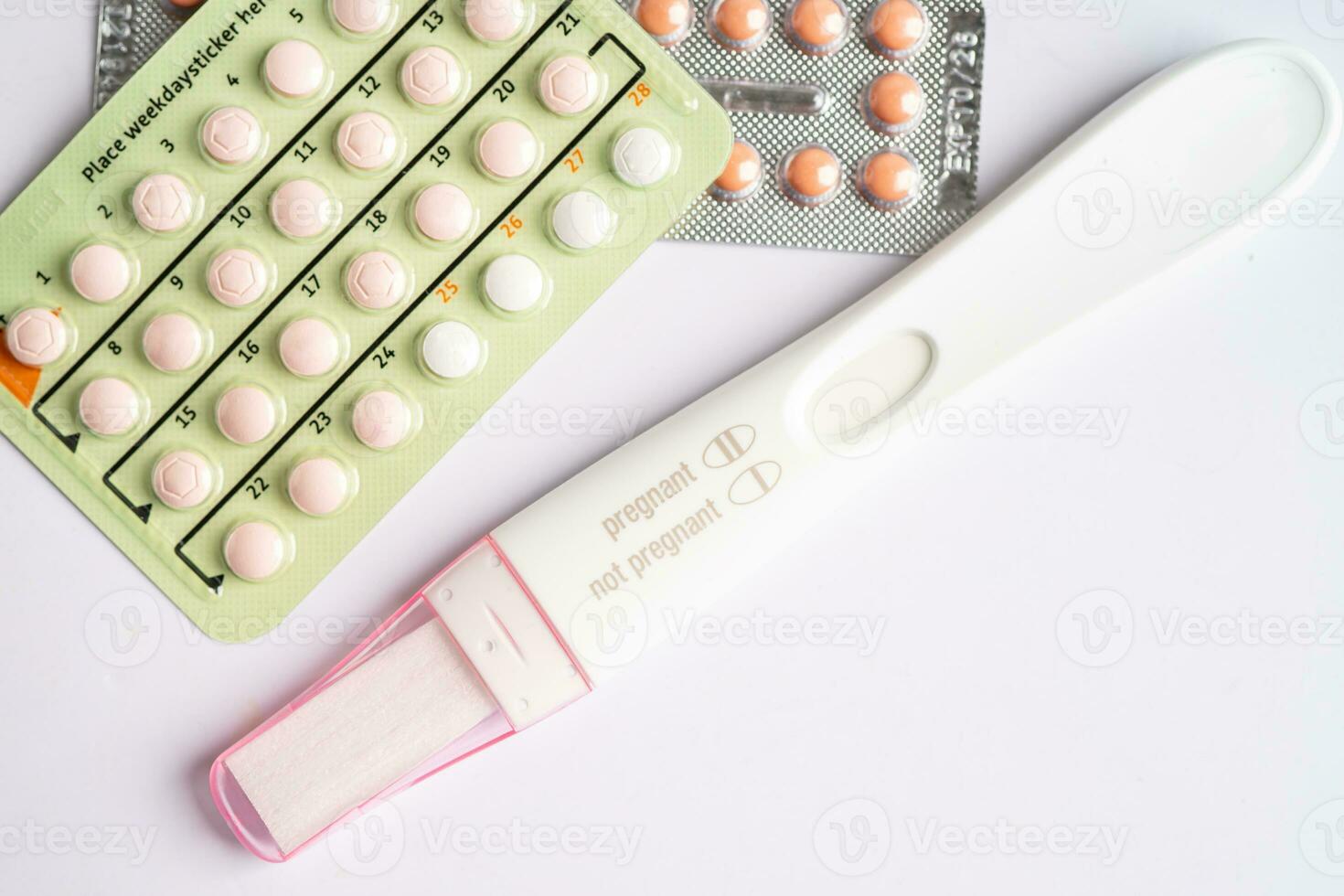 Pregnancy test and birth control pills, contraception health and medicine. photo