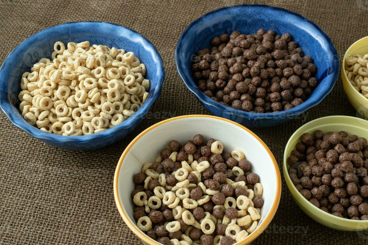 Set of various cereal bowl for breakfast. Corn rings with chocolate and cereal. photo
