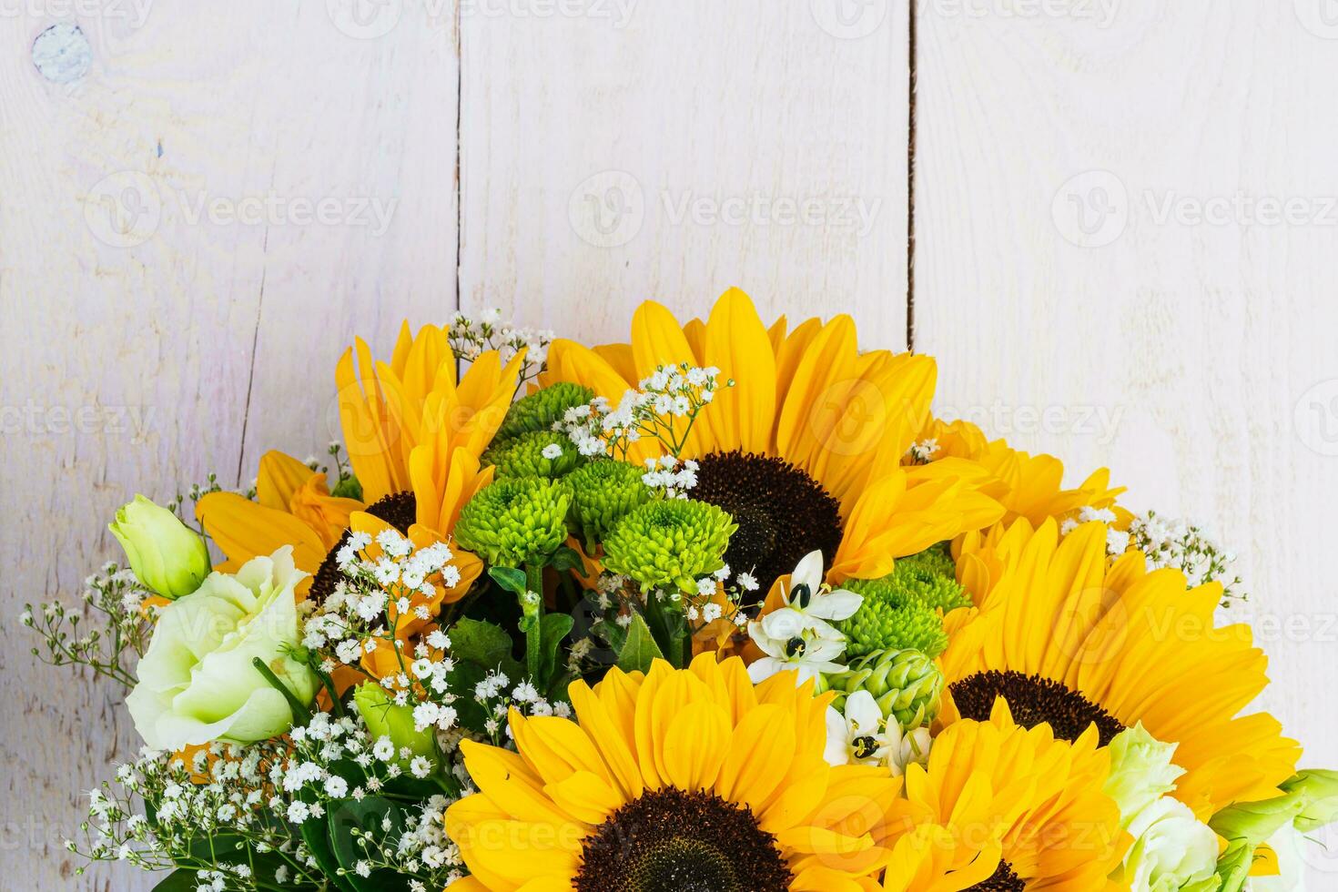 Wedding bouquet of sunflower on a wooden background. Top view with copy space. photo