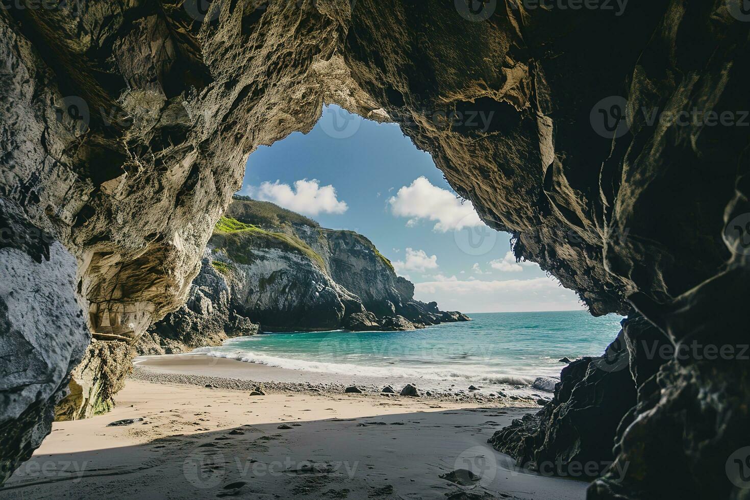 AI generated the beach from the inside of a large, rock cave photo