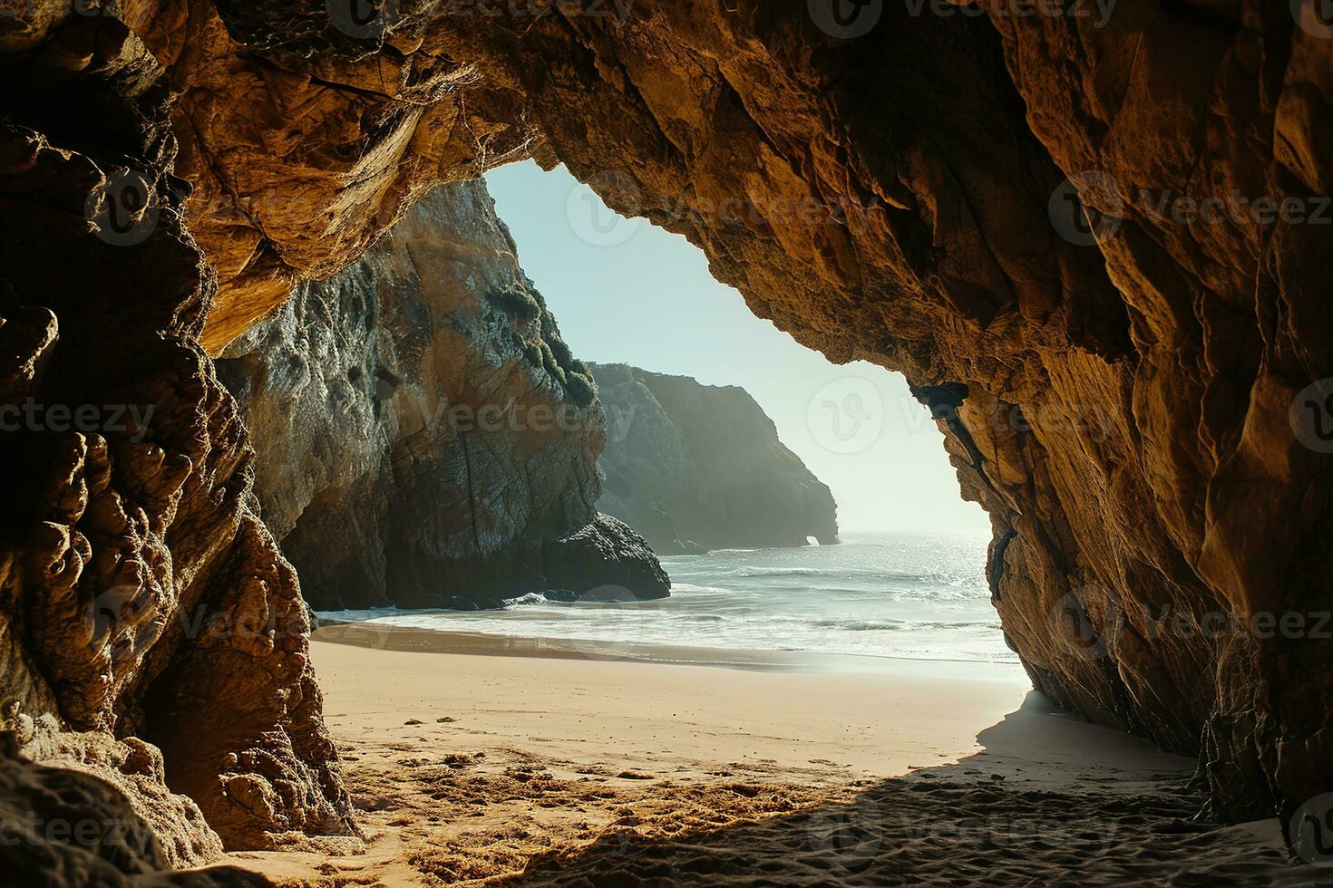 AI generated the beach from the inside of a large, rock cave photo