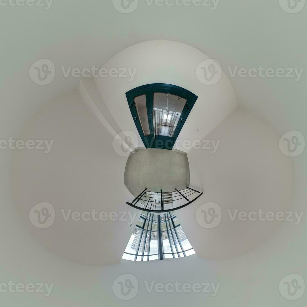 abstractly twisted into a spherical 360 panorama interior of a modern office with a hall staircase and panoramic windows photo