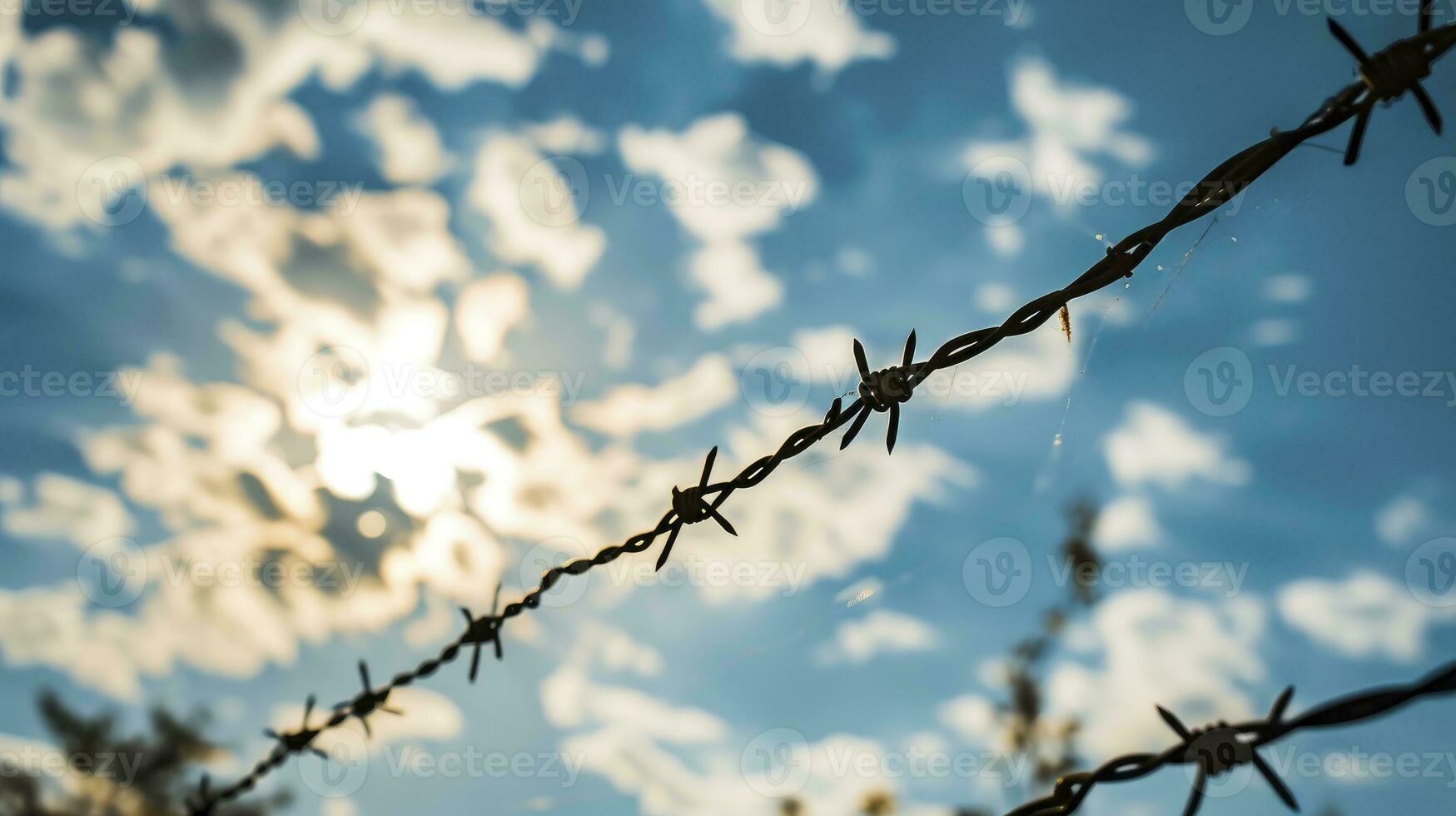 AI generated Barbed wire in front of blue sky with cloud photo