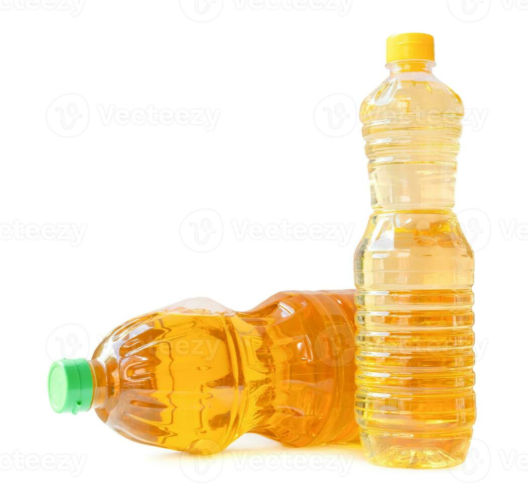 Two bottles of vegetable oils in stack isolated on white background with clipping path. Front side view and flat lay photo