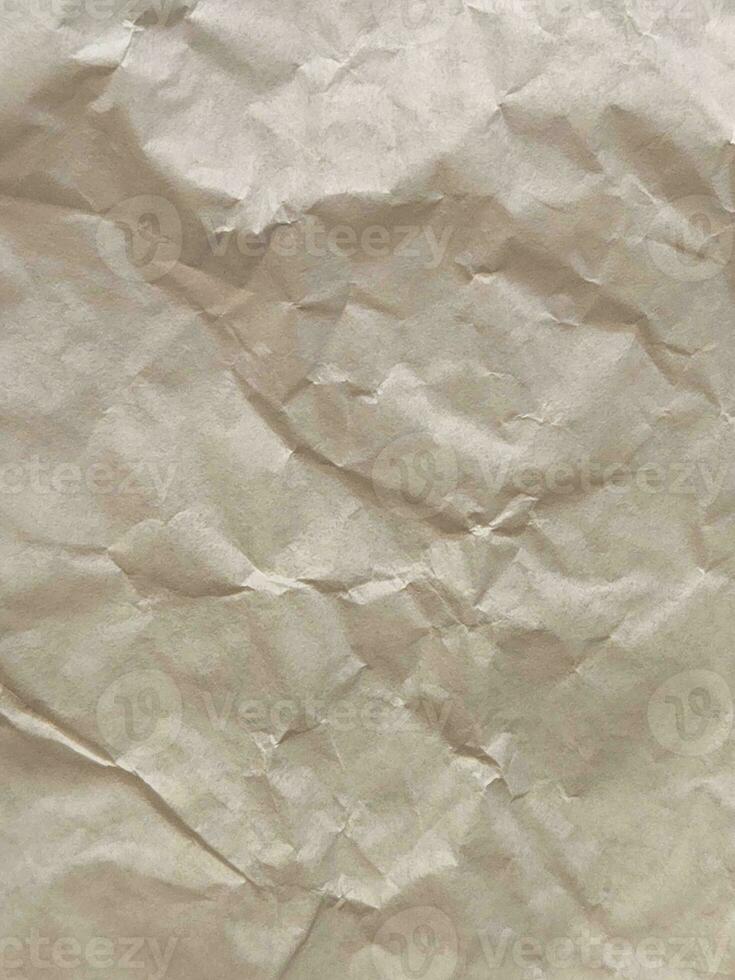 Crumpled paper. Crumpled light parchment. Vintage crumpled paper background photo