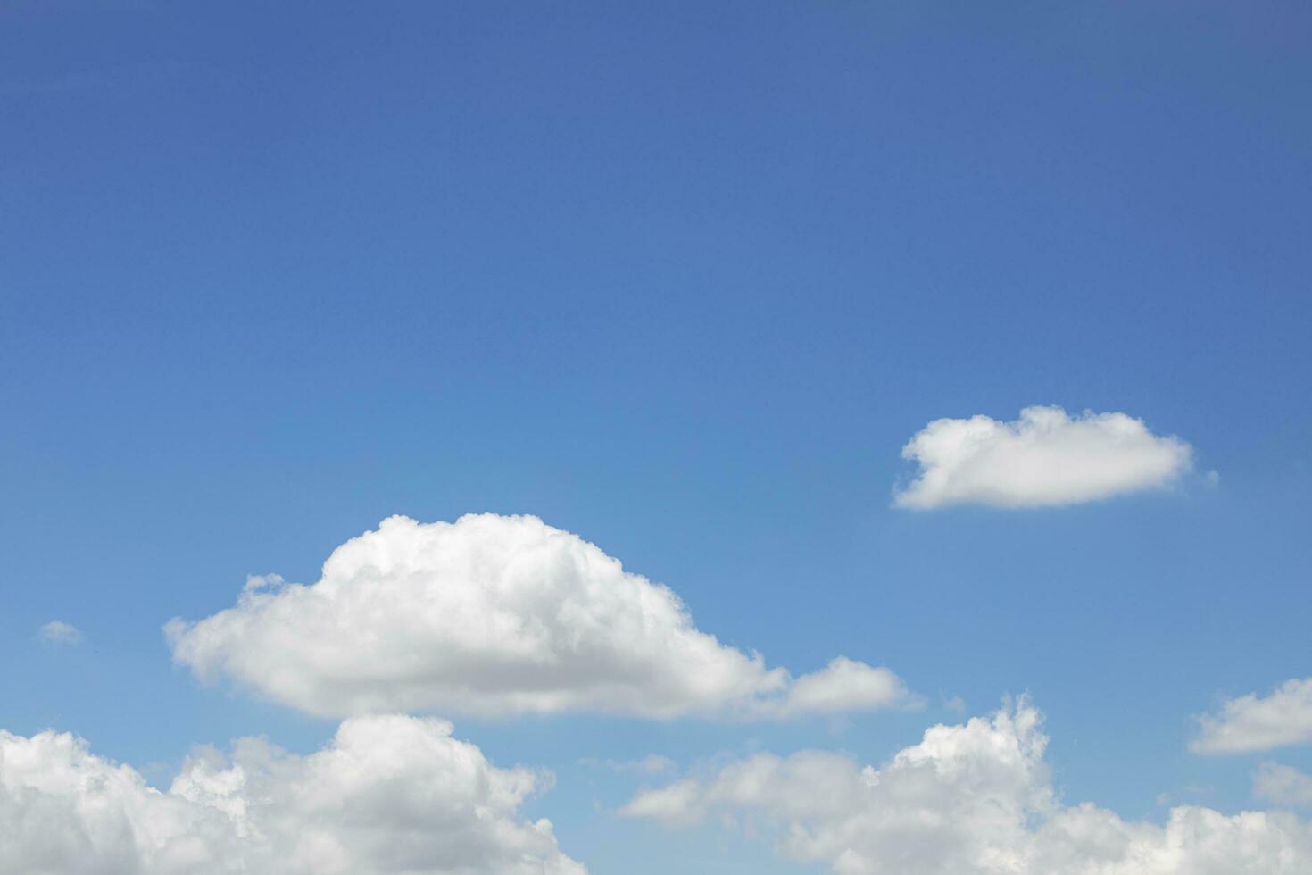 Blue sky background and white clouds soft focus, and copy space horizontal shape. photo