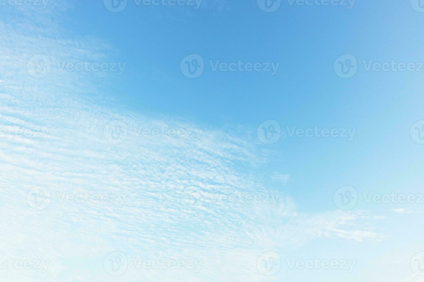 Blue sky background and white clouds soft focus, and copy space horizontal shape. photo