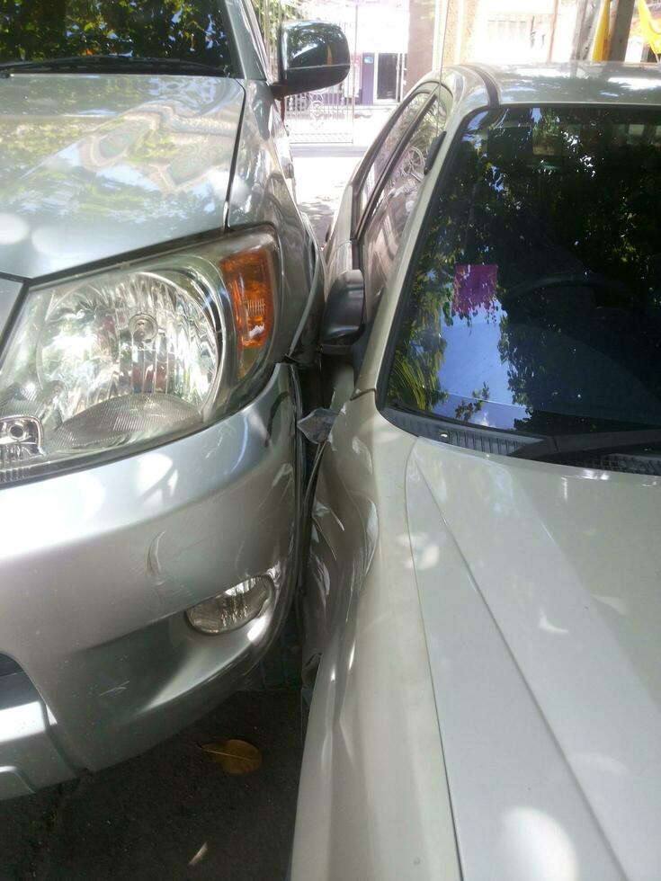 Close up two cars's fender crash beside of the car, Thailand. photo