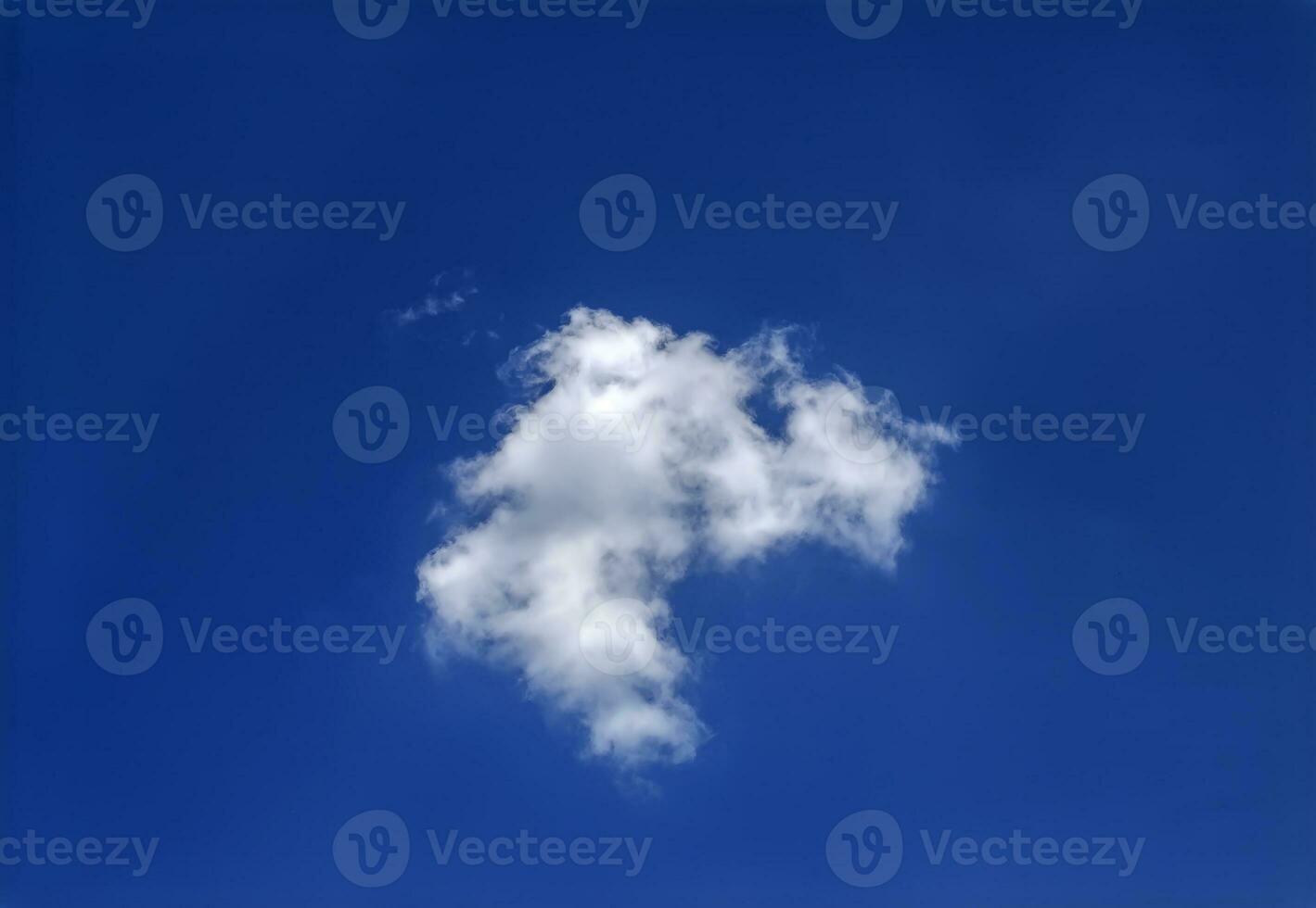 Single white cloud isolated over blue sky background, summer fluffy cloud photo