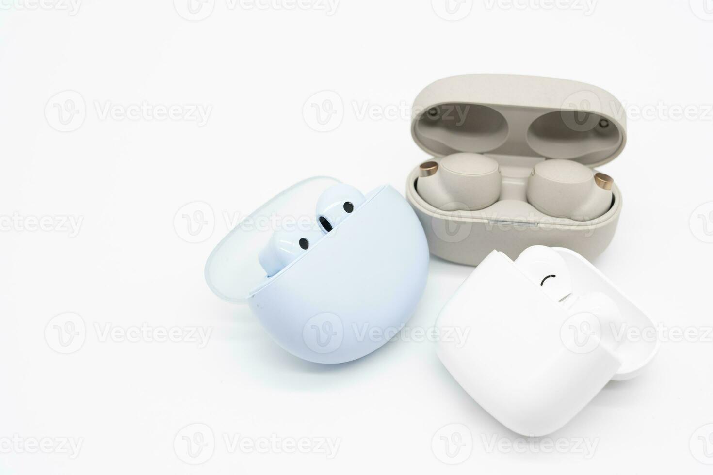 Different types of Truly wireless earphones with charging case. photo
