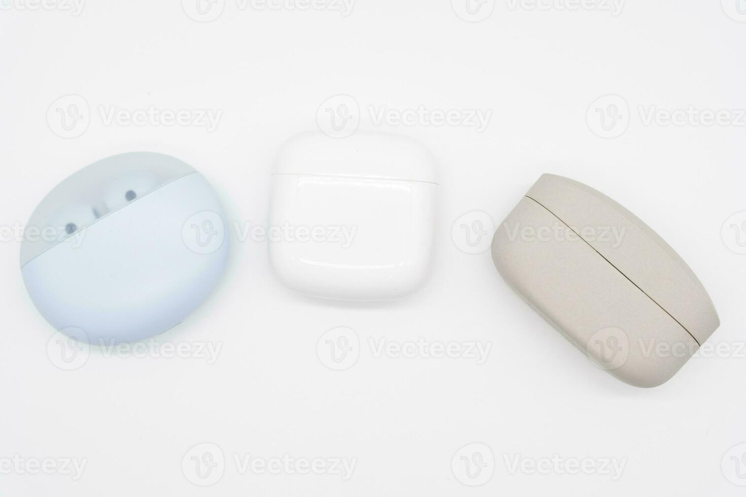 Different types of Truly wireless earphones with charging case. photo