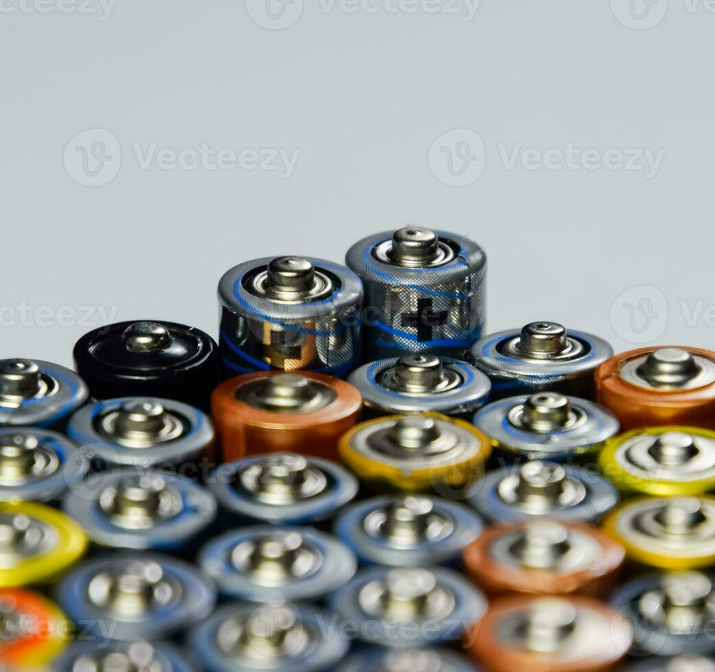 Salt and alkaline batteries, source of energy for portable technology. AAA and AA batteries photo