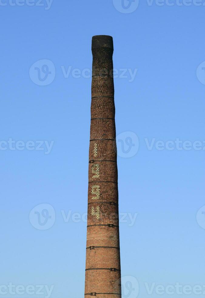 brick factory chimney. Tube for propulsion bricks in the furnace photo