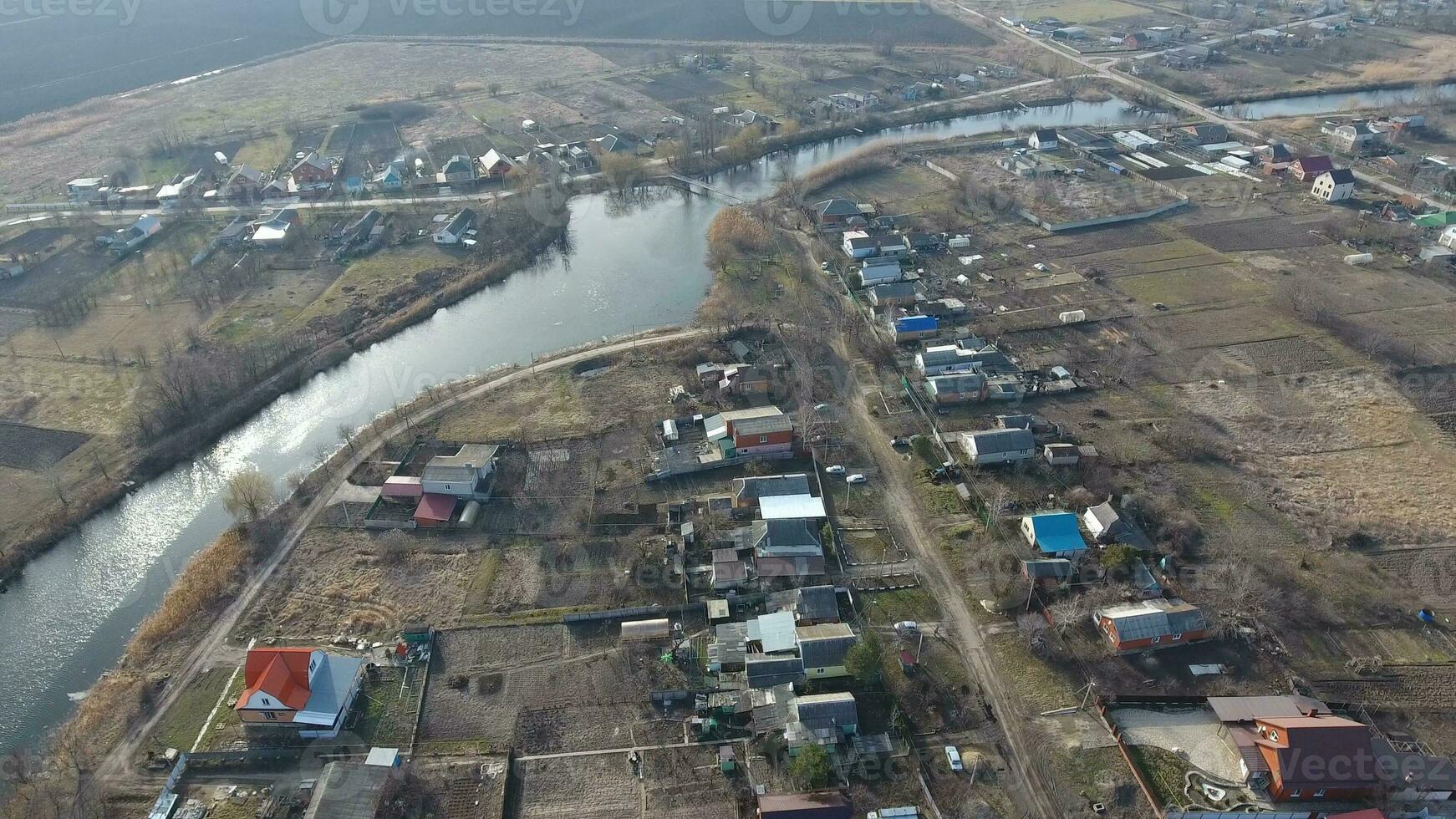 View from the top of the village. Streets without asphalt and single-storey houses. The Kuban village. photo