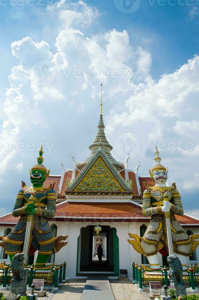 Big Giant Statues Guardian Landmark of Wat Arun Monastery at Bangkok of Thailand photo