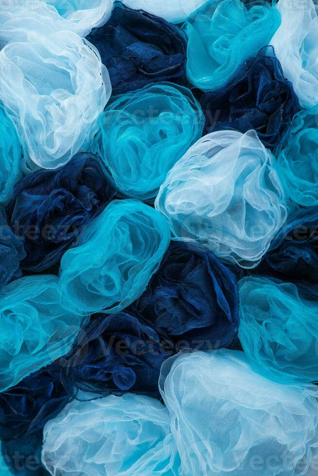 Background of the blue fabric flowers photo