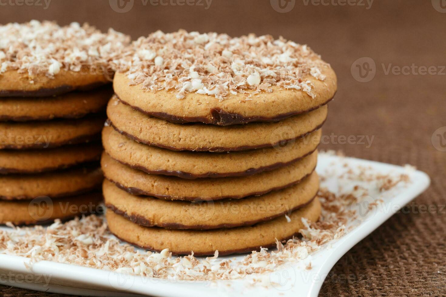 Round cookies with chocolate in a plate photo