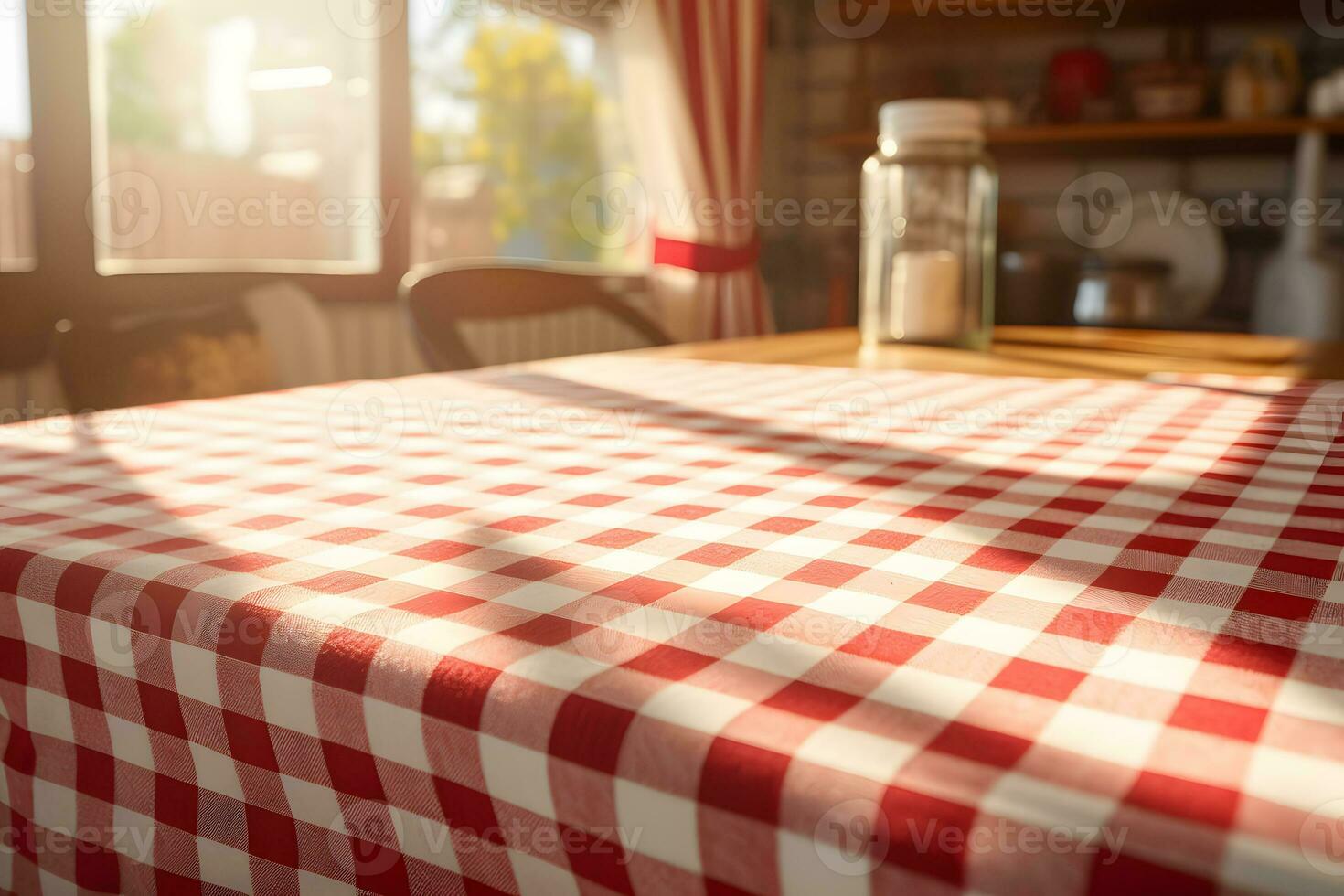 Empty table with red and white checkered tablecloth in the kitchen photo