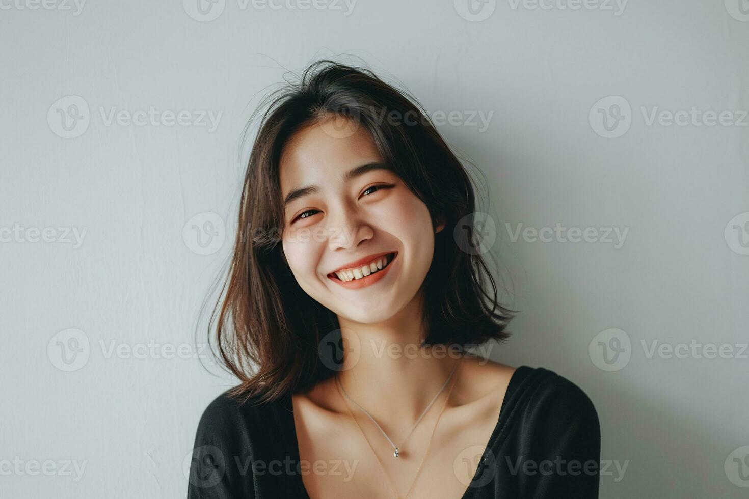 ai generado asiático mujer parpadeo a cámara sonriente alegre en pie blanco pared foto