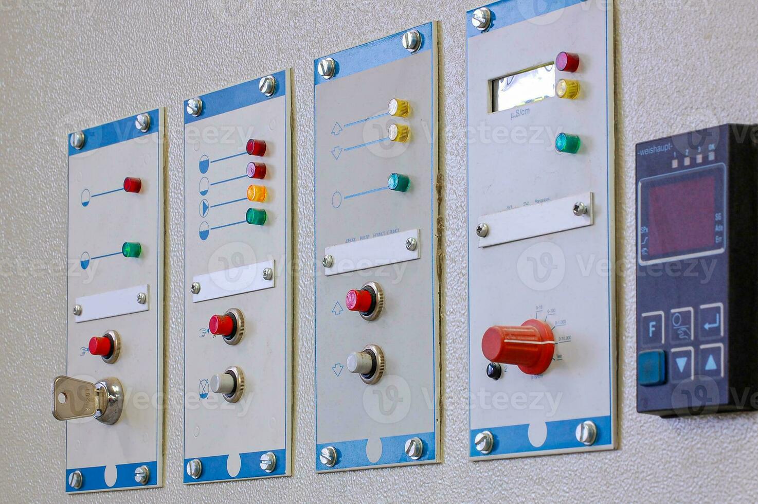 Switches on an industrial control board. Lamp indicator and switch of power control panel. photo