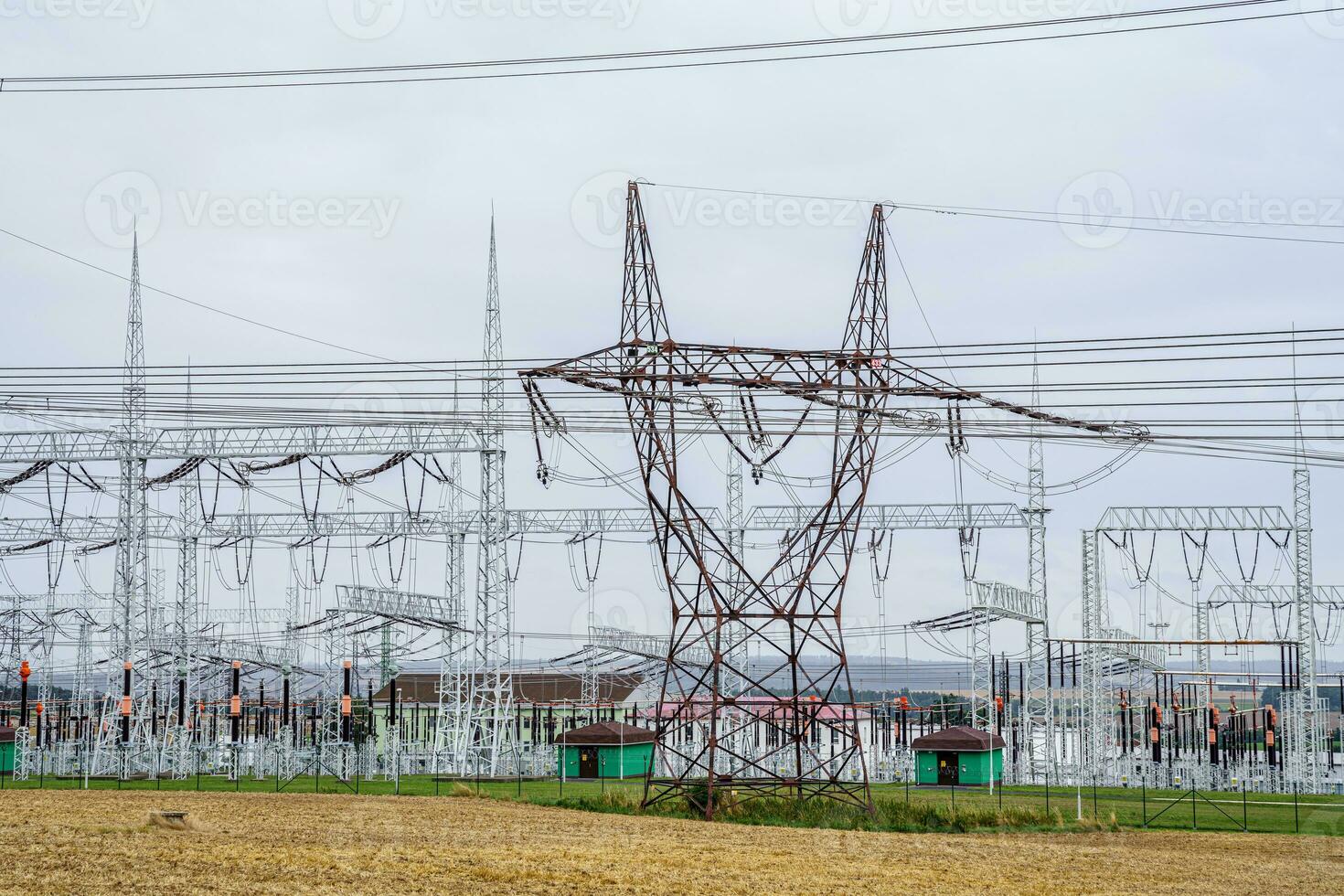 Distribution electric substation with power lines and transformers. High voltage power transformer substation. photo