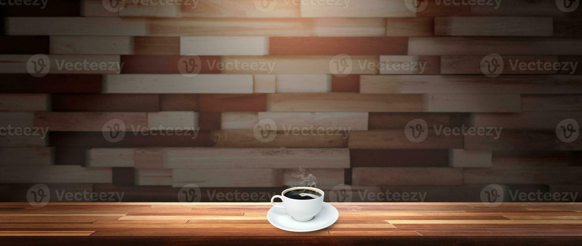 Coffee cup on white plate on wooden table with wooden wall background photo