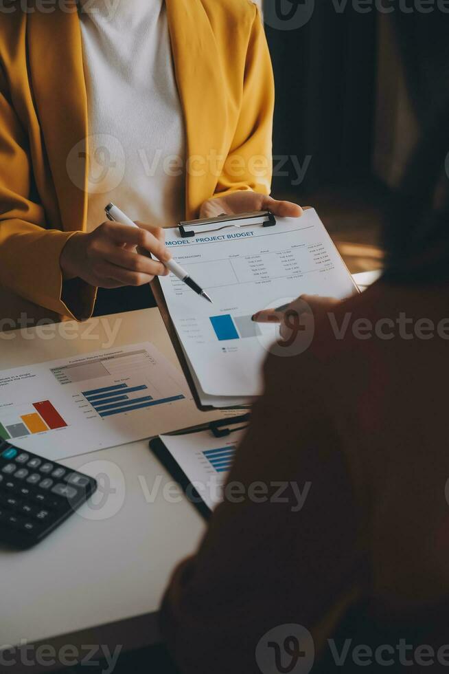 Team of business people working together in the meeting room office, teamwork background charts and graphs banner, double exposure successful teamwork,business planning concept. photo