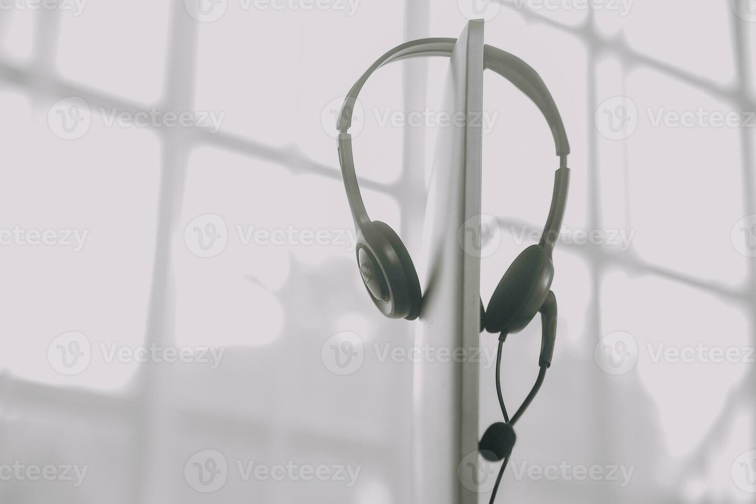 Communication support, call center and customer service help desk. VOIP headset on telephone keyboard. photo