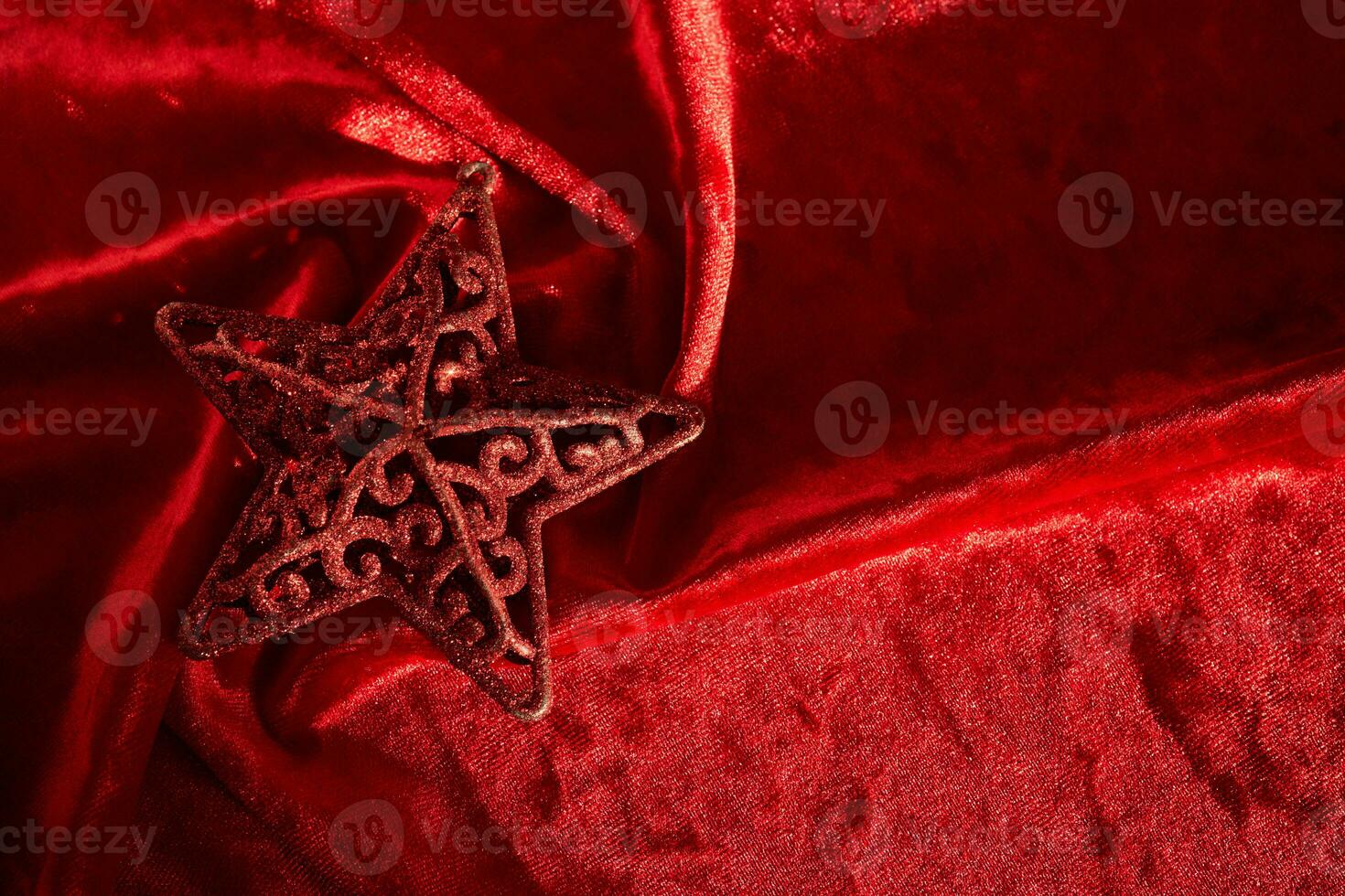 Abstract Christmas background with star on a red velvet background. photo