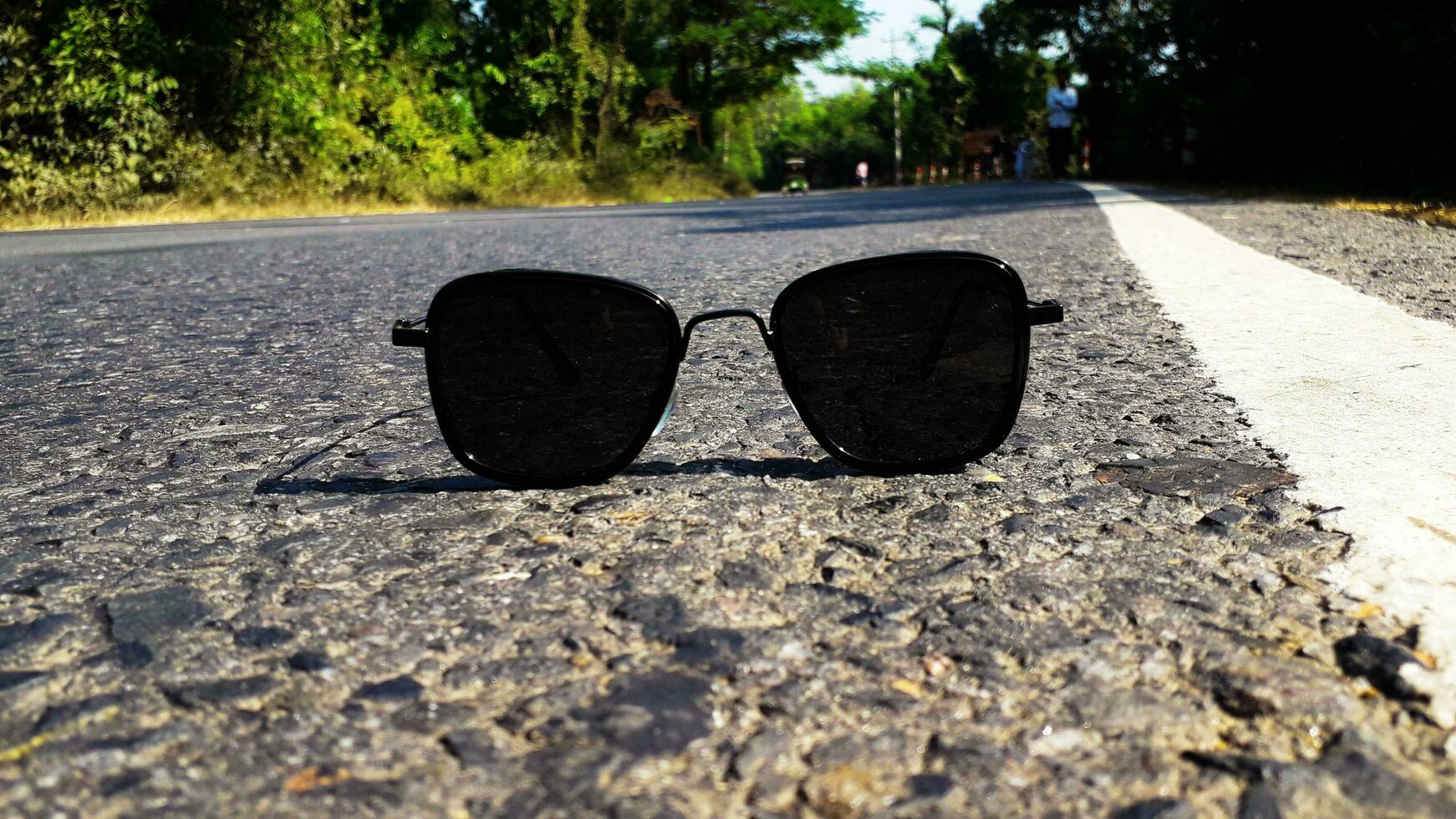 Sunglass On Highway Road photo