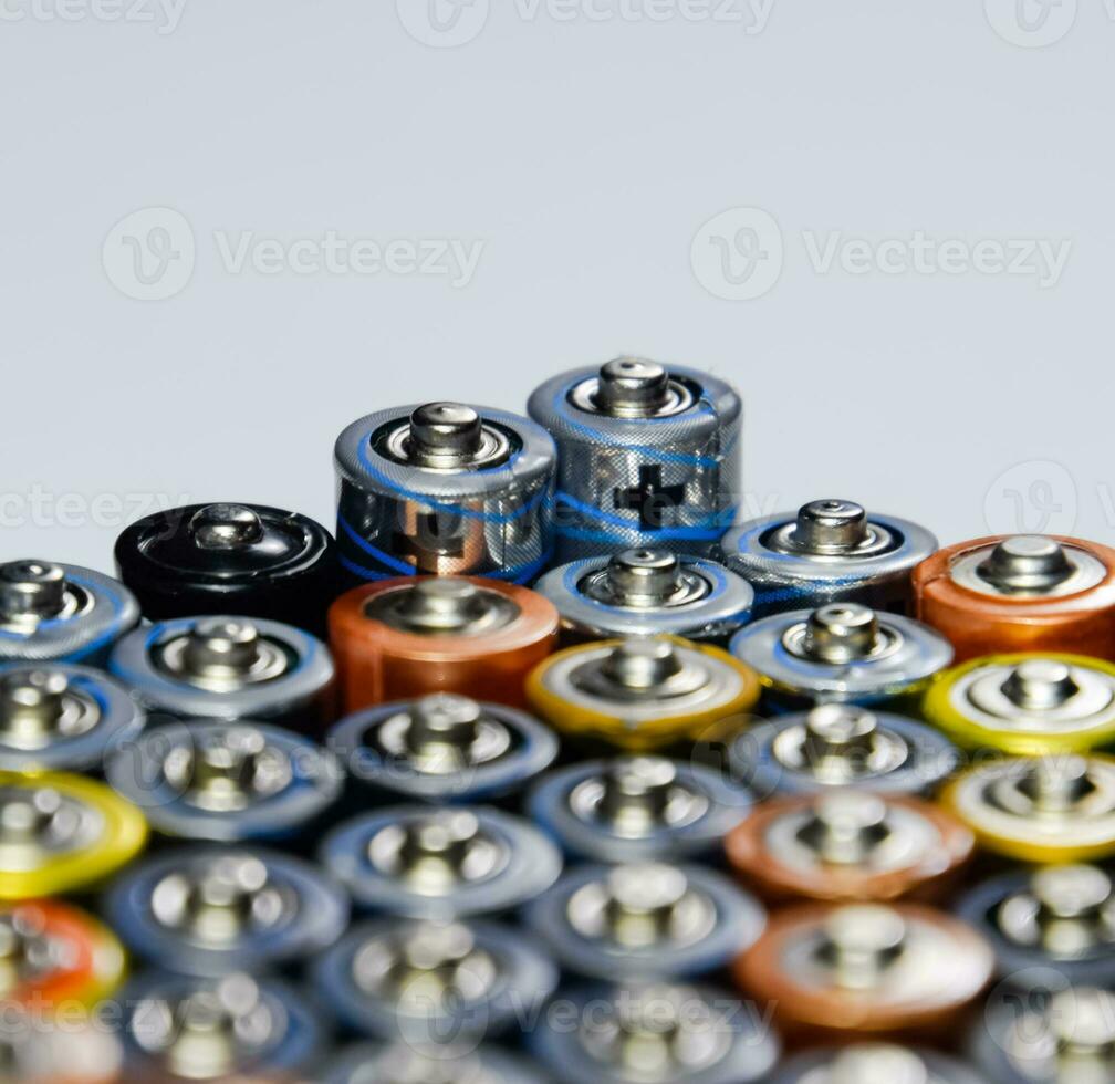 Salt and alkaline batteries, source of energy for portable technology. AAA and AA batteries photo