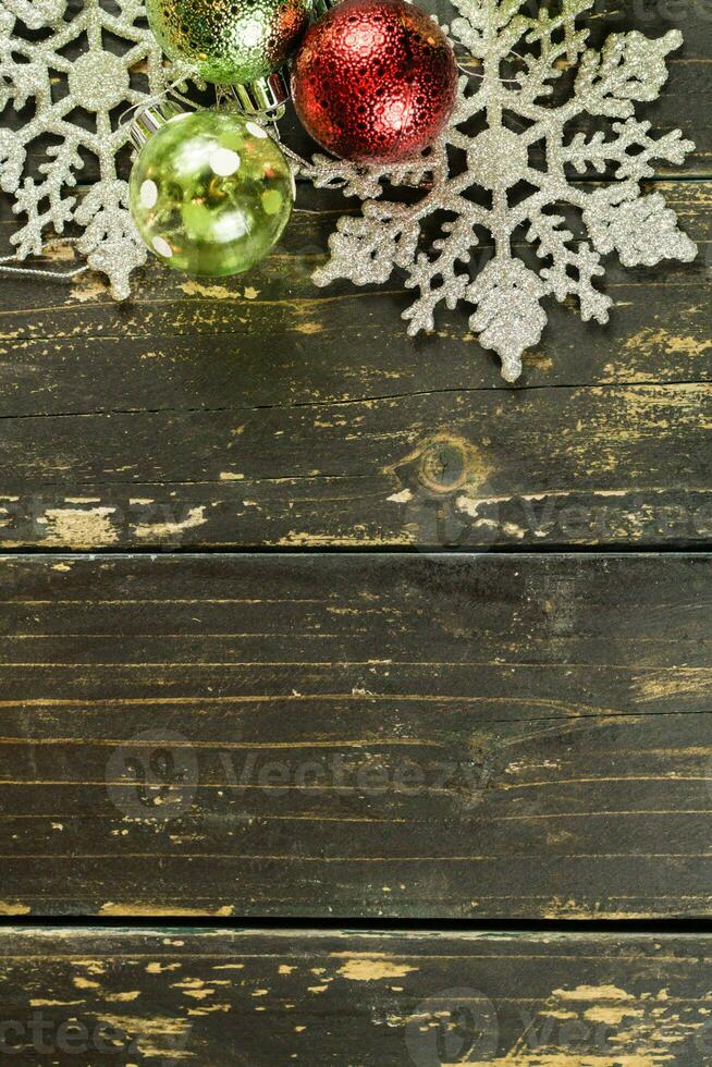 Christmas Holiday Ornaments on a Dark Wood Background. photo