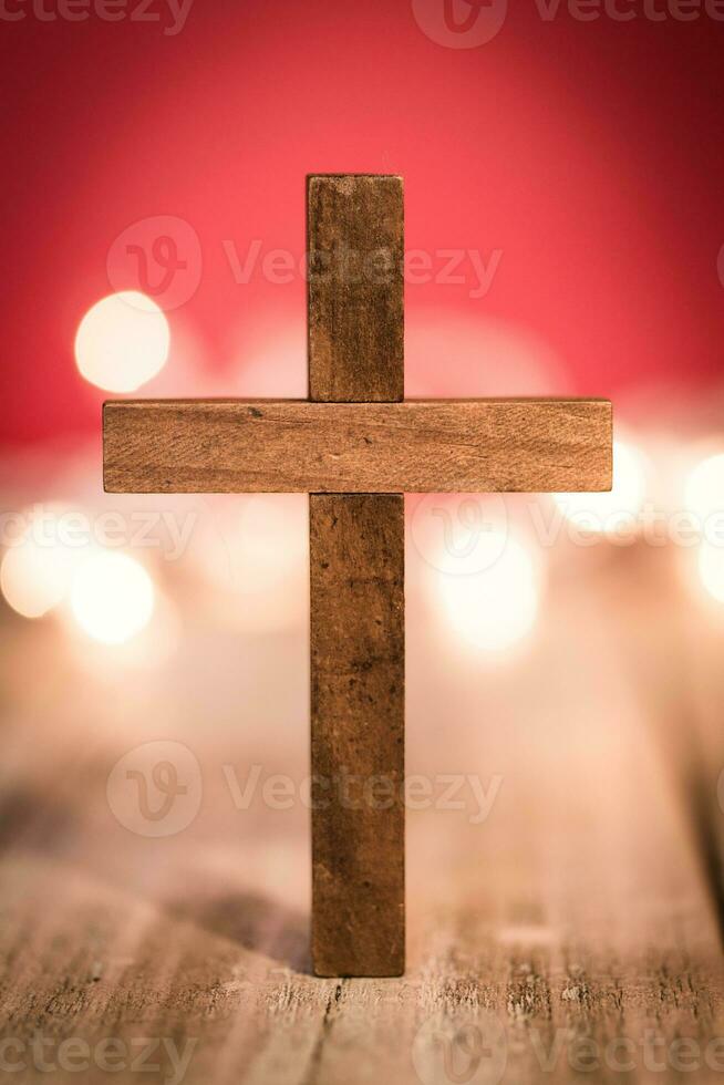 Holy Christian Wooden Cross on an Abstract Red Background photo