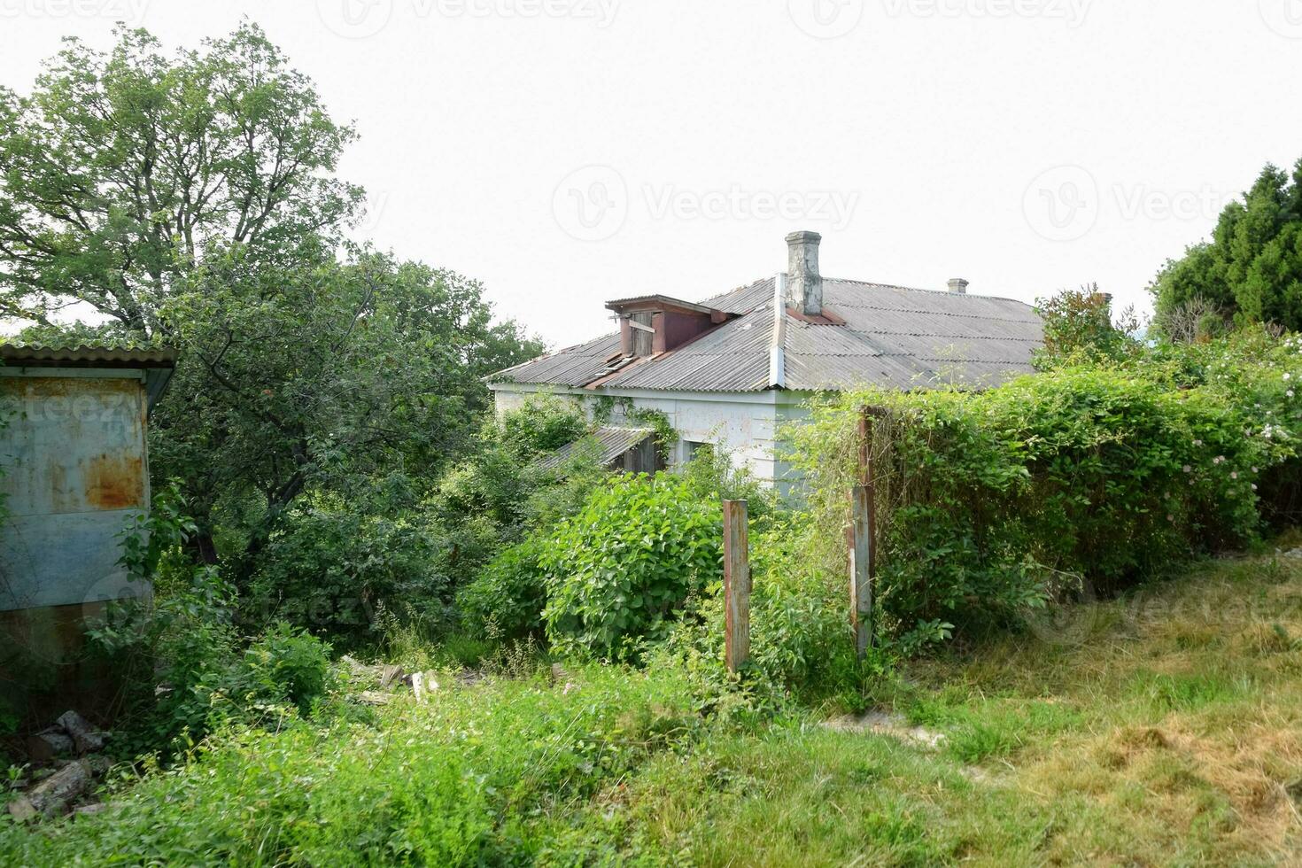 Old dilapidated houses in abandoned village photo