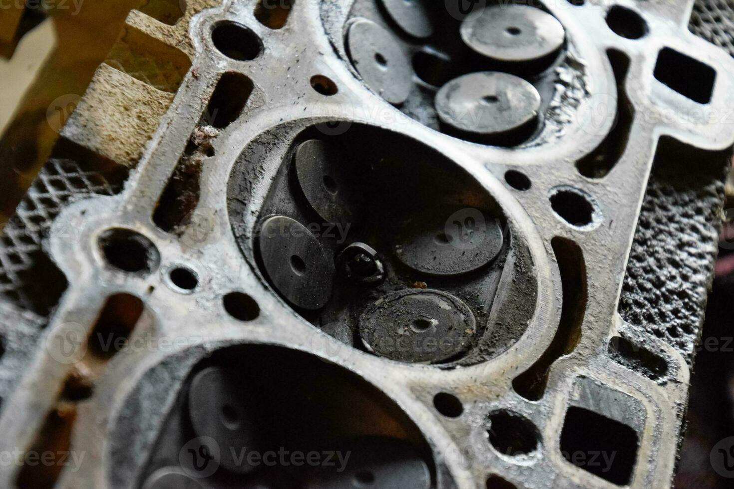 Valve in a deposit on the removed cover of the engine valve box. photo