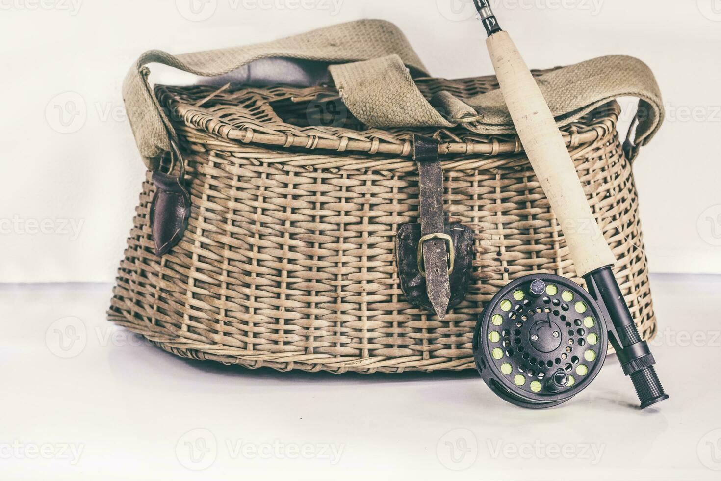 Fly Fishing Rod and Fish Creel on a White Background photo