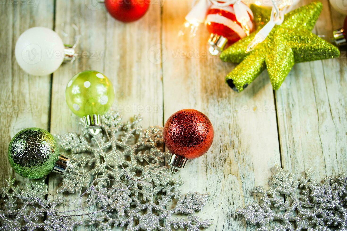 Christmas Holiday Lights and Ornaments on Wood Background photo