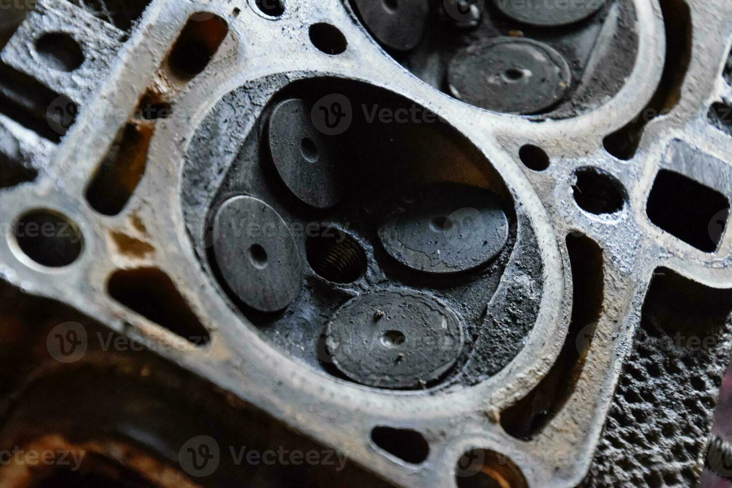 Valve in a deposit on the removed cover of the engine valve box. photo