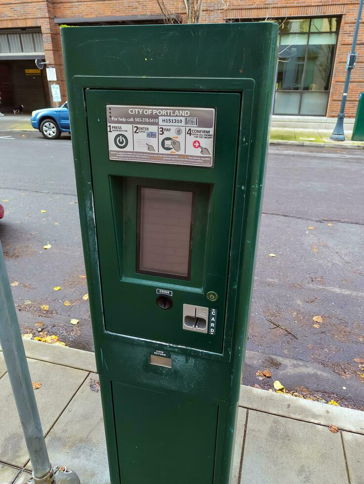 Portland, Oregon, USA - 12.28.2023 Parking meter on a city street. photo