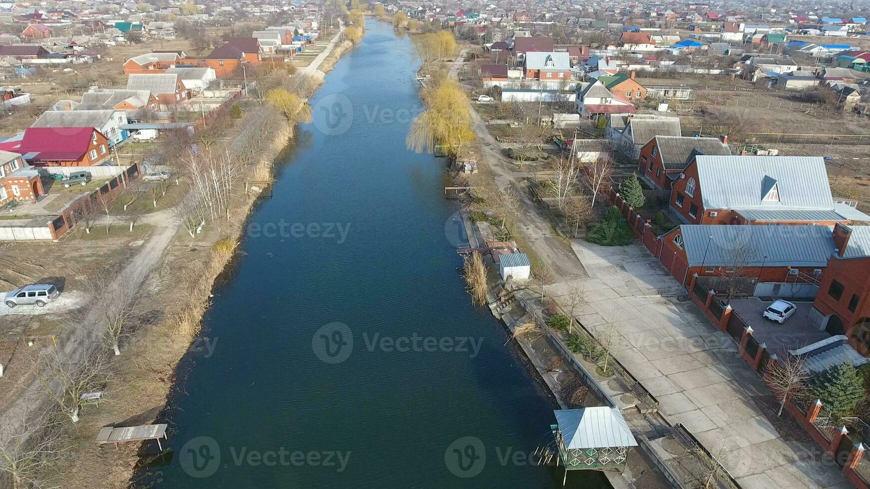 View from the top of the village. Streets without asphalt and single-storey houses. The Kuban village. photo