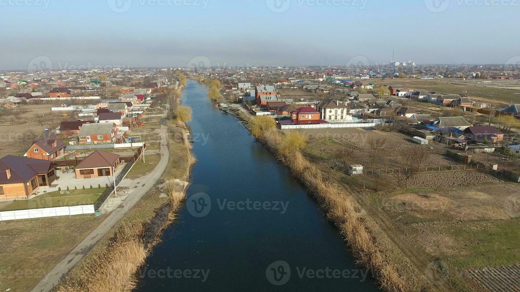 View from the top of the village. Streets without asphalt and single-storey houses. The Kuban village. photo