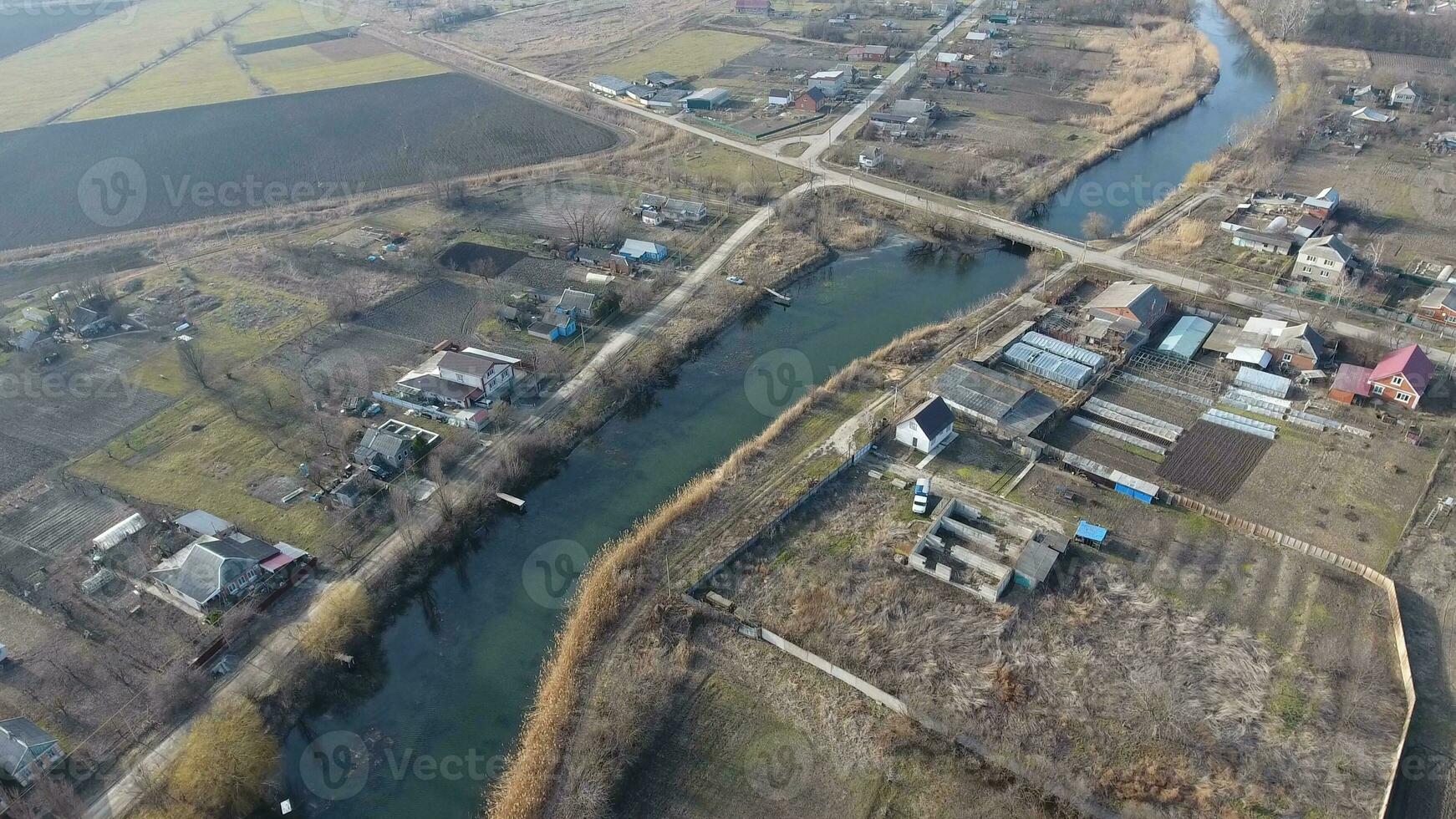 View from the top of the village. Streets without asphalt and single-storey houses. The Kuban village. photo