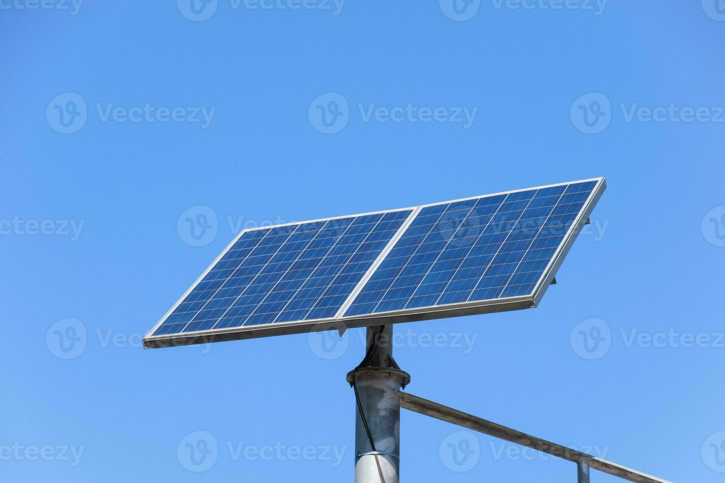 Solar panels on a pole to power a traffic light photo