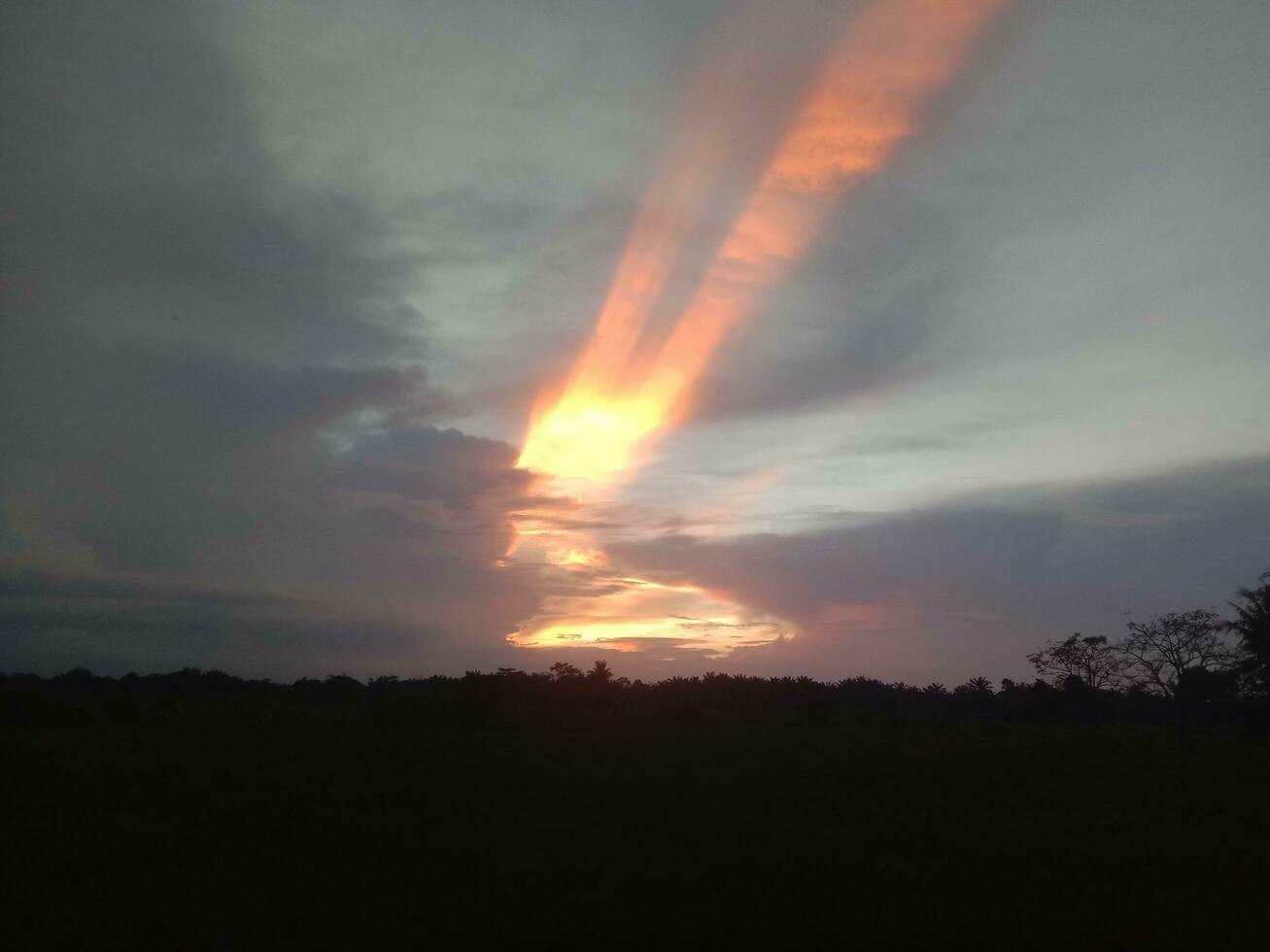 the sky at dusk with a beautiful sunset background photo