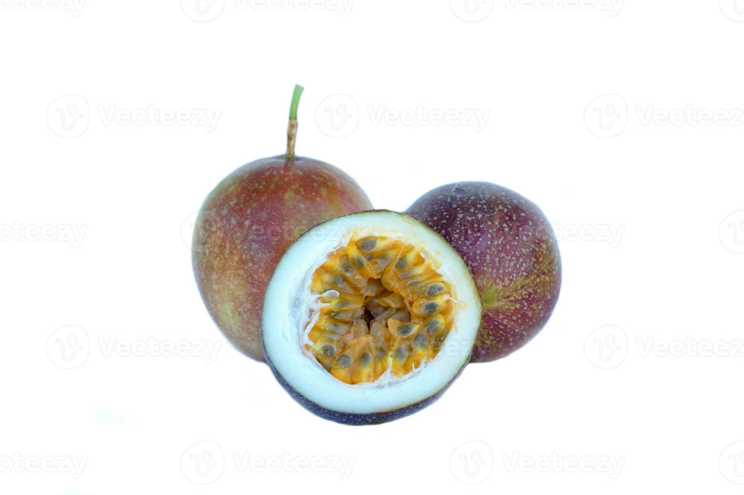 isolated passion fruit on white background. The passion fruit has an oval shape, a thick, oily rind. There are many seeds inside the fruit. It is a healthy fruit with high fiber content. photo