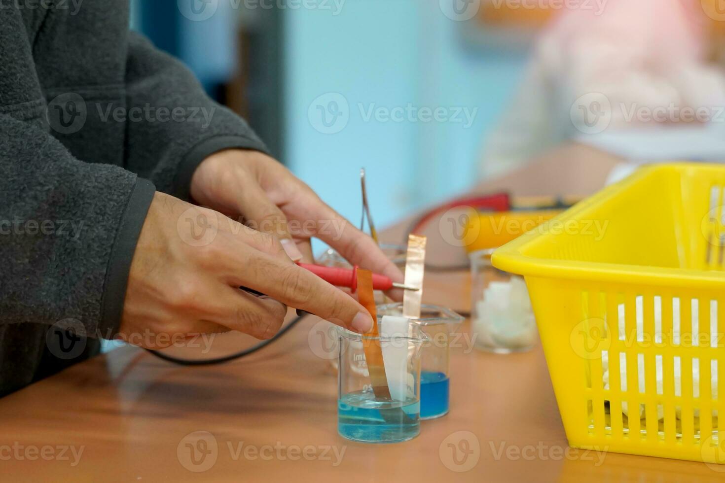 Students measure electric current by experimenting with creating a galvanic cell, which is an electrochemical cell that uses a chemical reaction to produce an electric current. photo