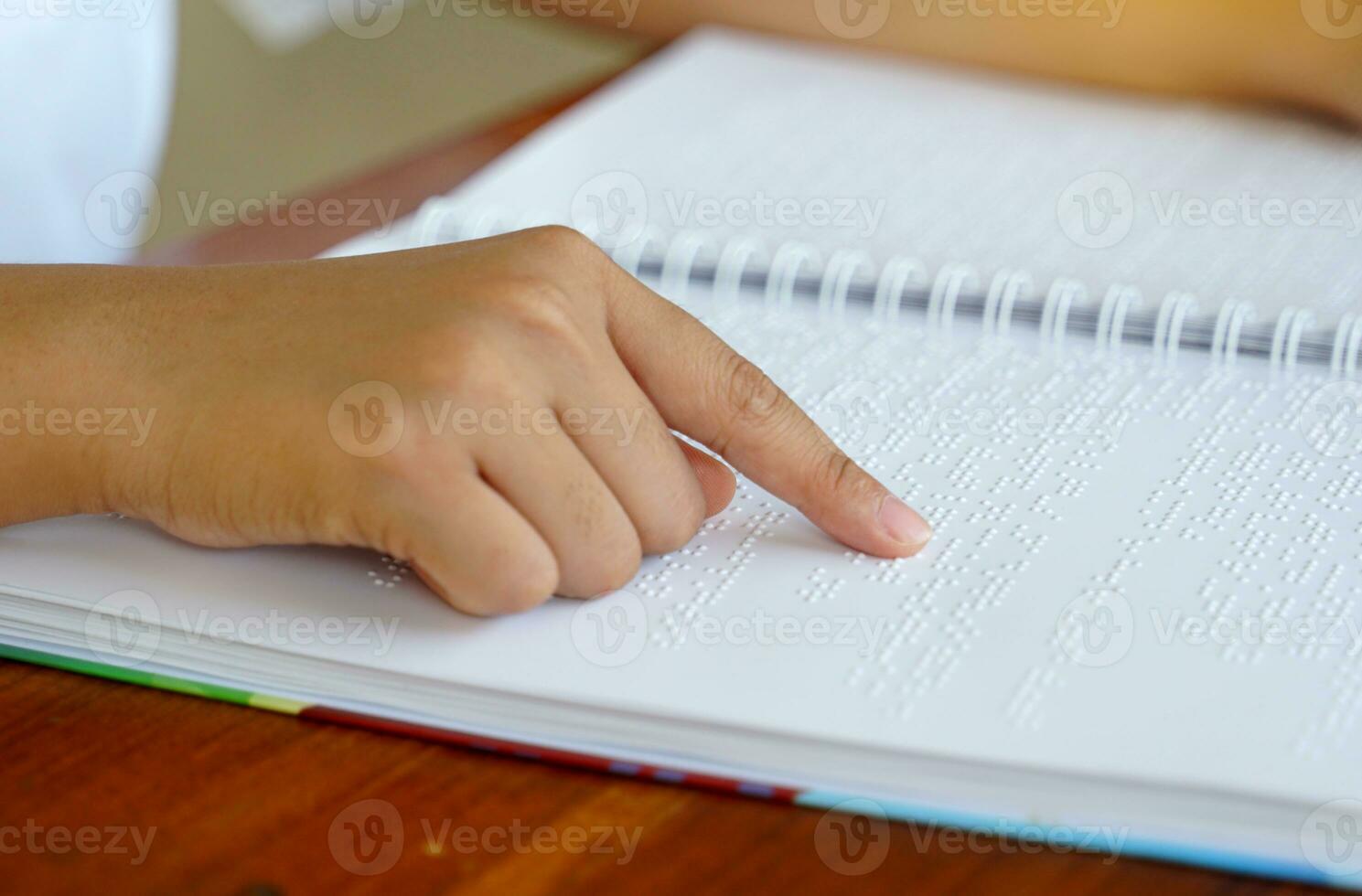 Hand palpation of the letter Bail, which is a letter for the blind, looks like a small convex point in one box, consisting of 6 points, which are arranged in alternating groups to form a code. photo