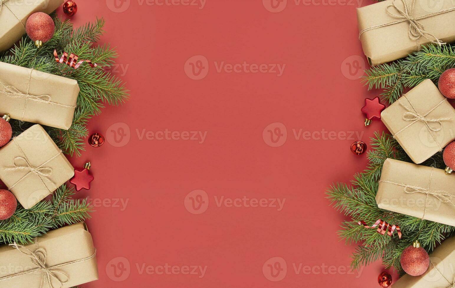 Christmas frame made of gift boxes, red balls, serpentine on a red background. Festive Christmas decorations. Christmas background. Banner layout, postcard. The apartment was lying. Copy space photo