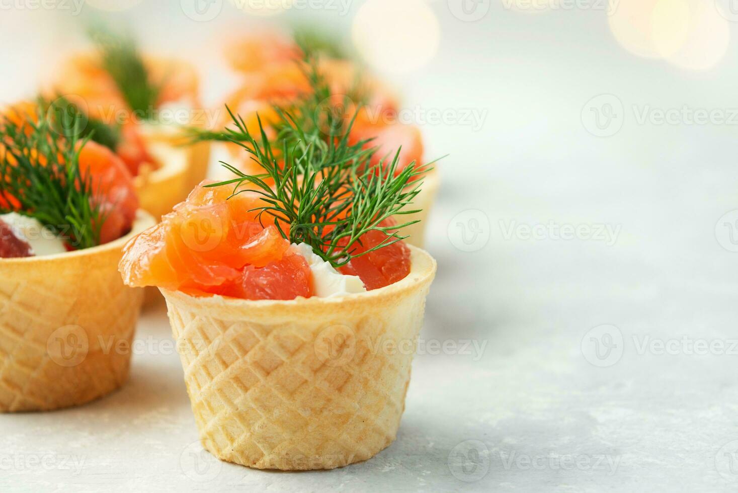 Snack with red fish on the table. Festive snack. Menu for the festive table. Side view. Copy space. photo