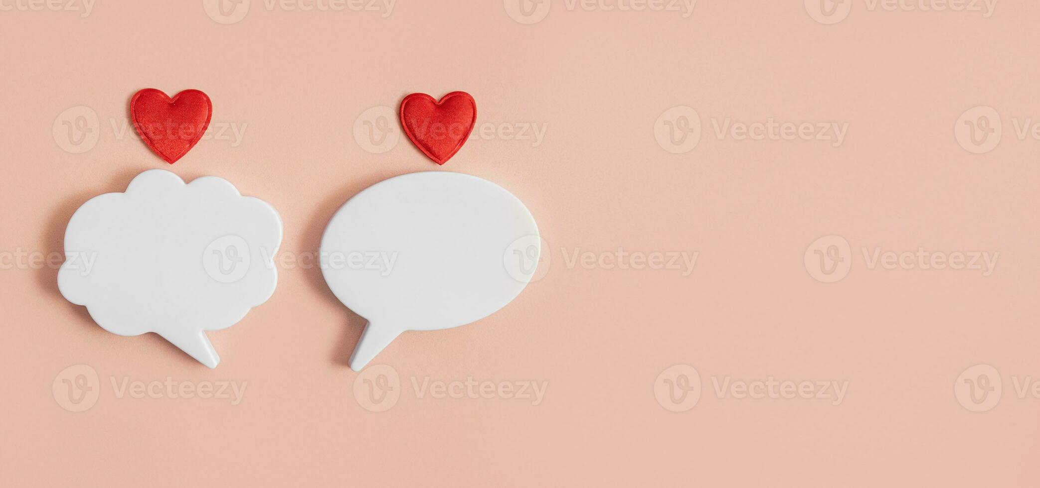 Chat icons with hearts on a light background. The concept of modern love. Valentine's Day. Long distance relationship. Online confession of love. Modern love. Copy space. photo